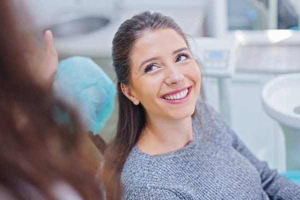 Woman smiling while at Djawdan Center for Implant and Restorative Dentistry for her sinus lift in Annapolis, MD