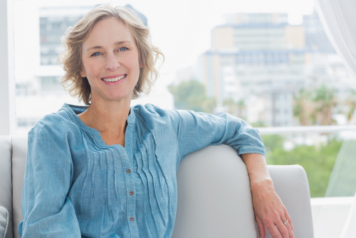 Older woman on the couch at Djawdan Center for Implant and Restorative Dentistry.